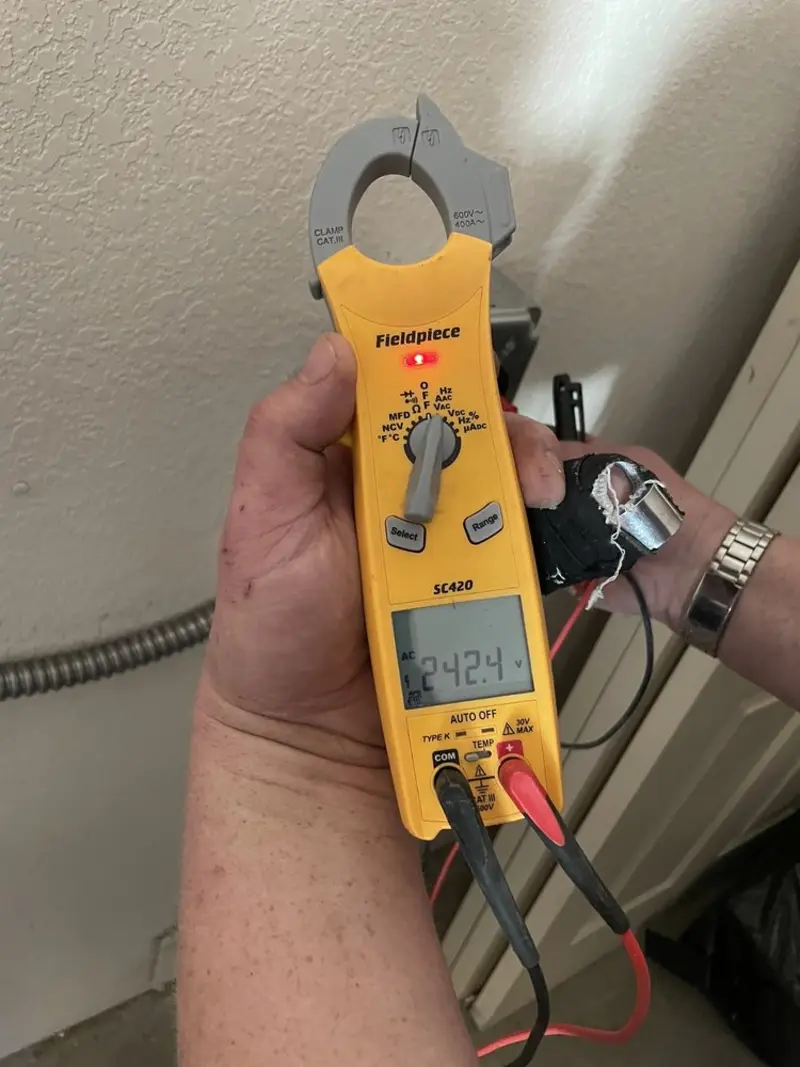 Voltage testing with clamp meter during Ceiling Fan Installation in Marshall